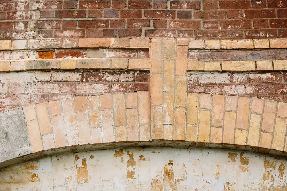 Tasmania Restoration project featuring custom brick joinery and arch detail on a heritage building façade